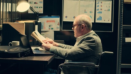 Senior law agent in wheelchair reviews witness statements, building a profile for the suspect....