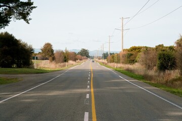 Sunny Day on New Zealand Highway - Scenic Road Through Countryside