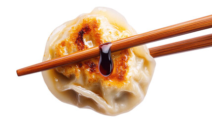 Delicious dumpling garnished with soy sauce, held with chopsticks. A perfect representation of Asian cuisine's rich flavors, transparent background.