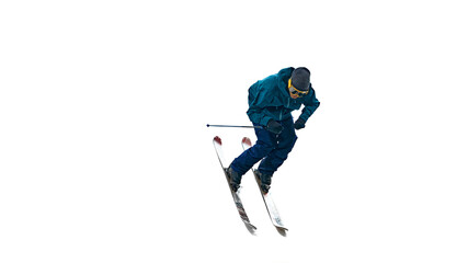 Active male skier in mid-motion, leans forward for swift descent. Movement and intensity of his...