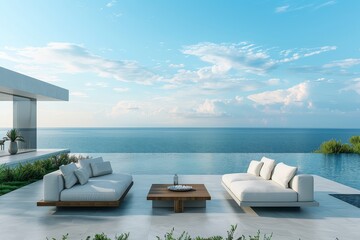 Fototapeta premium Beach-style outdoor sofa with modern wooden coffee tables on concrete slabs, overlooking green grass and an infinity pool with an ocean view under a blue sky.