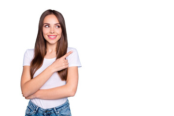 Fototapeta premium Portrait of cute person looking showing ads on copy space wearing white t-shirt denim isolated over blue background