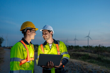 Diverse ethnicity male technicians working in the wind turbines field. 