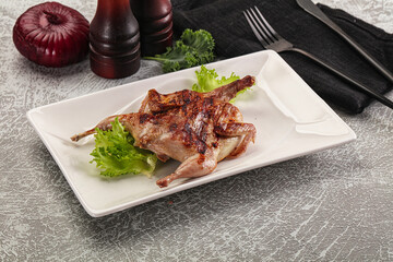 Grilled quail in the plate