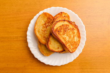 Close-up of baguette croutons, Toasts, bruschetta from sliced baguette, close up, white plate.