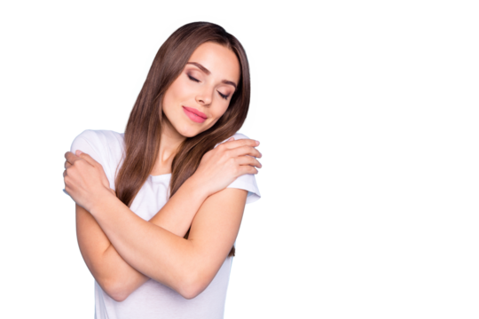 Portrait of cute lady touching her shoulders closing eyes wearing white t-shirt isolated over blue background