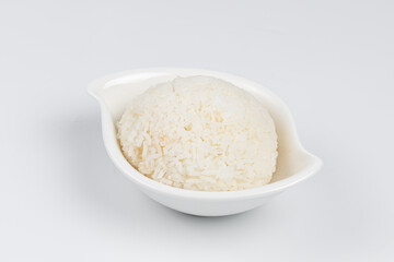 Rice in a white bowl on a white background