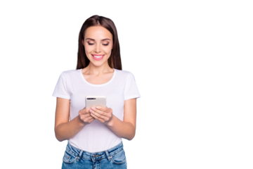 Portrait of charming youth looking at modern technology reading wearing white t-shirt isolated over blue background