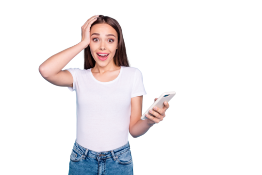 Portrait of impressed cute lady screaming wow omg touching her head wearing white t-shirt jeans isolated over blue background