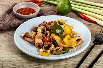 Roasted octopus with vegetables and oil