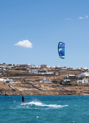 A sky surfer on the beach on the island of Mykonos in Greece