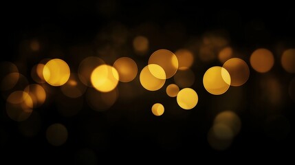 Blurred golden bokeh on black background.