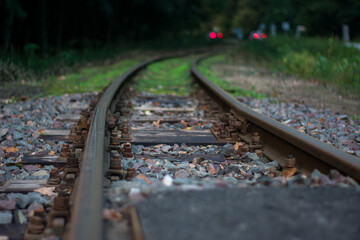 The train tracks are empty and the train is not visible