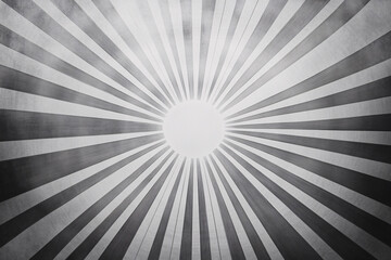 Obraz premium Monochrome abstract sunburst with black and gray rays expanding from a central point, forming a circular pattern and gradient effect 