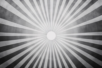 Obraz premium Black and white radial stripes creating a sunburst pattern with a central white circle 
