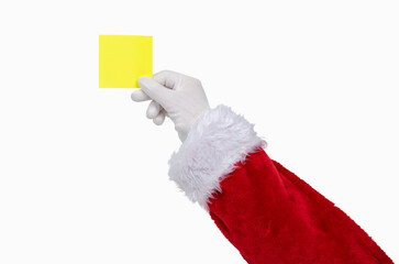 Shot of an Santa Claus hand holding a yellow notepaper on a white isolated background