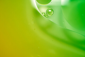 Green oil on the surface of the water separates.