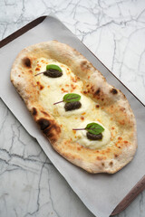 Pizza with truffle cheese and pita bread, top view