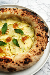 Pizza with fruits, pear, fig and pine nut