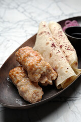 Chicken lula kebab with vegetables and pita bread