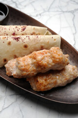 Chicken lula kebab with vegetables and pita bread