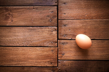 Egg on a rustic wooden board