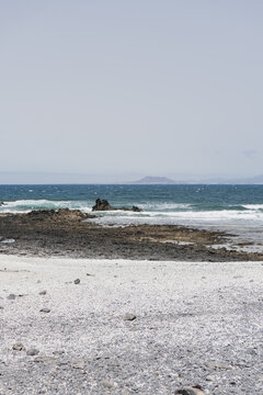 Popcorn beach with clear blue waters in Fuerteventura, Spain