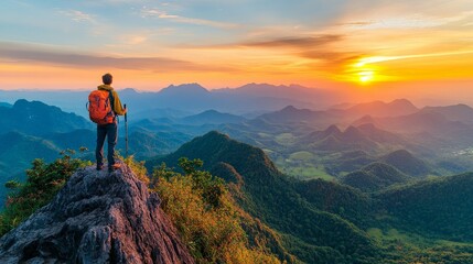 Fototapeta premium A hiker standing in the mountains