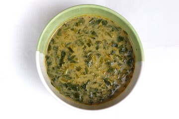 Spinach vegetable porridge is served in a bowl