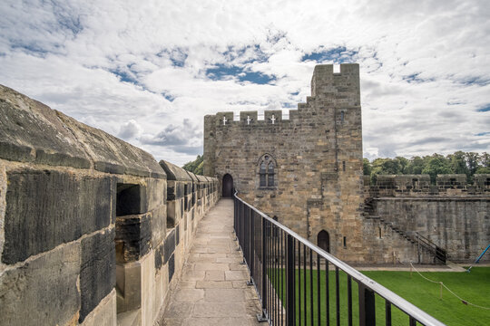 Alnwick, England - 5 August 2017: Alnwick Castle in Alnwick in the English county of Northumberland, United Kingdom. It is a location for films and programs.