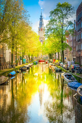 South Church Zuiderkerk and Houses over canal with mirror reflections, Amsterdam, Netherlands