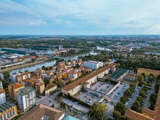 Aerial view of a cityscape with river and industrial areas.