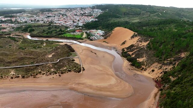 Dunes on the banks of the Tornada River at Salir do Porto Alcobaca, Portugal - aerial drone