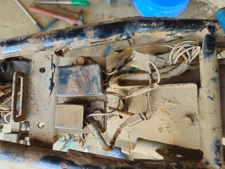 Close Up of motorbike mechanic busy repairing bike at garage. Industry concept of professional occupation, repair man and skill labor.