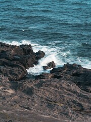 Ocean waves crashing against rocky cliffs