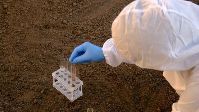 Taking soil samples in nature. Selective focus.