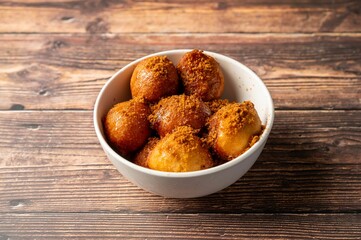 Fried dough balls with brown sugar