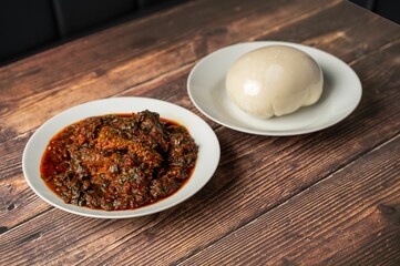 African vegetable soup with assorted meat and pounded yam.