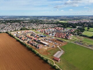 Aerial view of a residential neighborhood and construction site