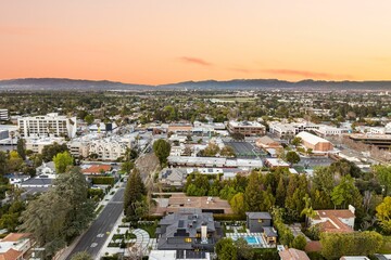Fototapeta premium Aerial view of suburban neighborhood at sunset.