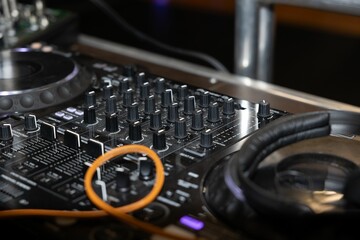 DJ mixer with headphones and cables