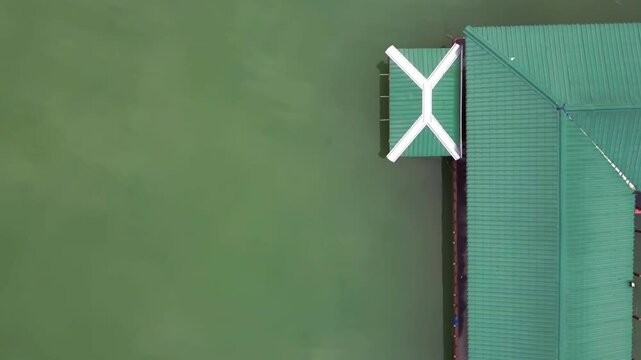 Above view of a floating home on Malaysia's Terengganu's Lake Kenyir.