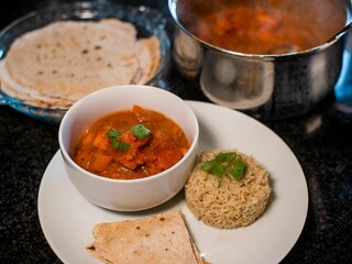 Indian food with curry, rice, and chapati