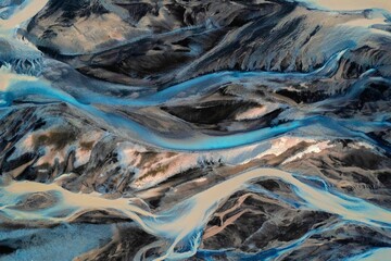 Aerial view of river streams in Icelandic volcanic landscape