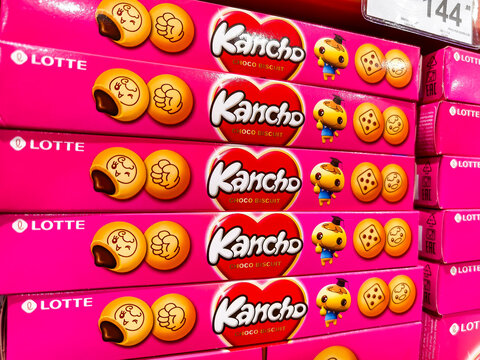 Colorful boxes of Lotte Kancho chocolate choco biscuits on supermarket shelf