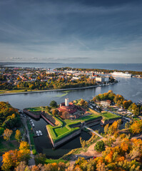 Obraz premium Wisloujscie fortress in autumnal scenery in Gdansk, Poland. Aerial view