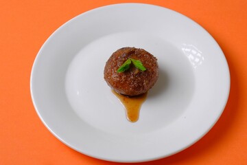 Single serving of dessert with mint garnish