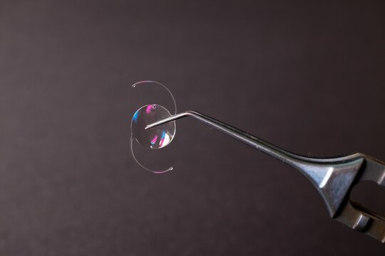 Surgical Tool Holding Intraocular Lens Implant