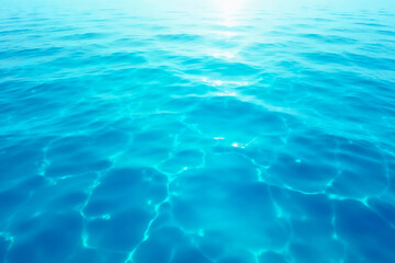 Crystal clear ocean water surface reflecting sunlight for backgrounds and textures