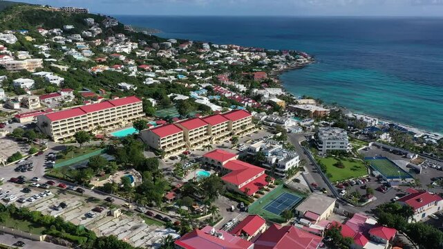 Drone view over the coastal buildings in Simpson Bay with ocean in the background, in Sint Maarten